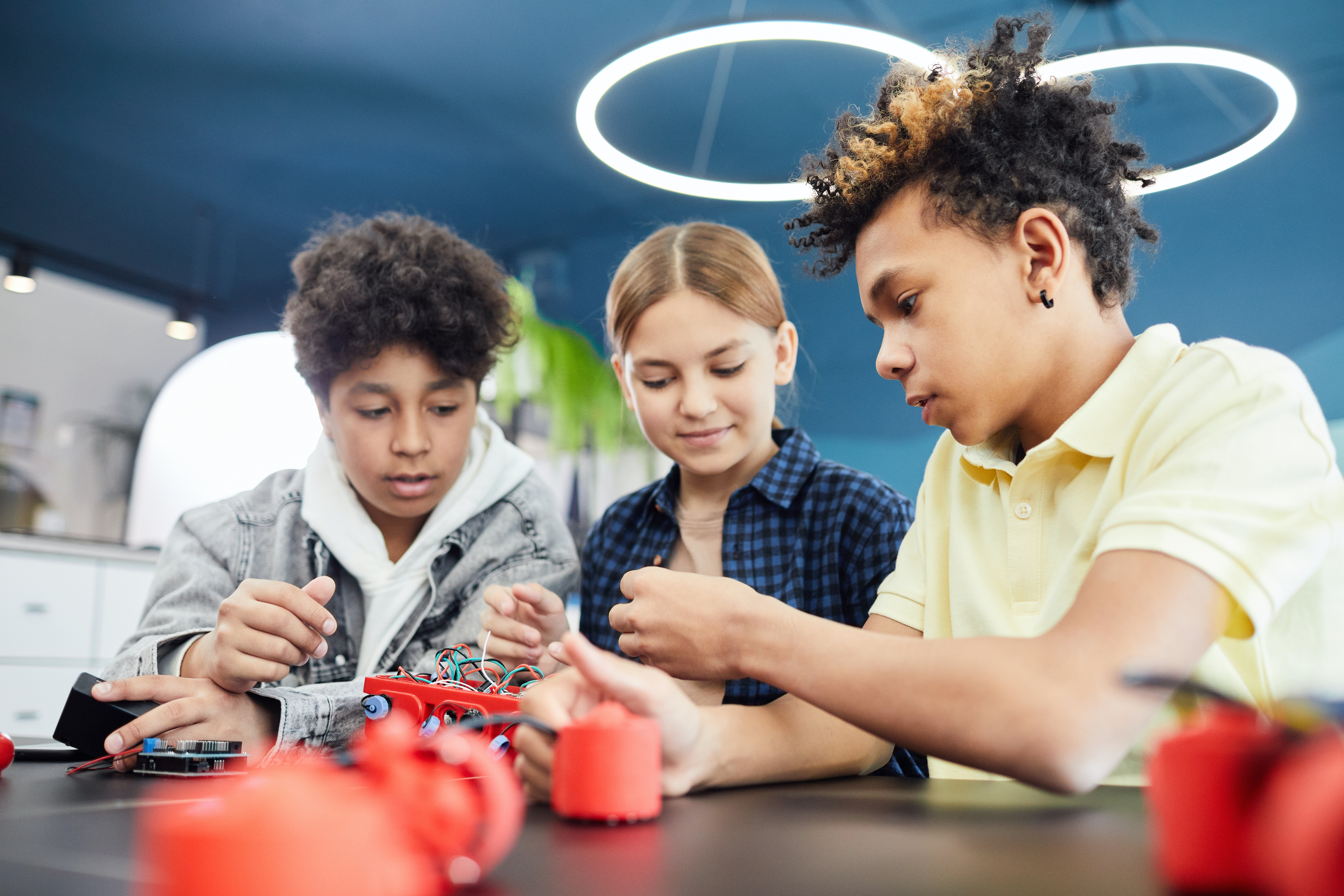 iSTEM Academy Image - After School STEM Enrichment, diverse group of kids exploring with robotics